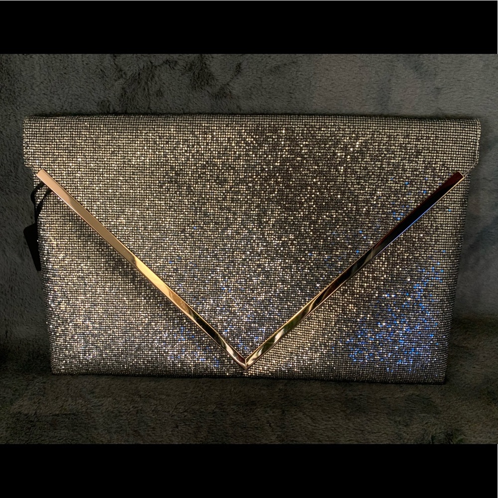 New sequence silver purse with gold trimming.